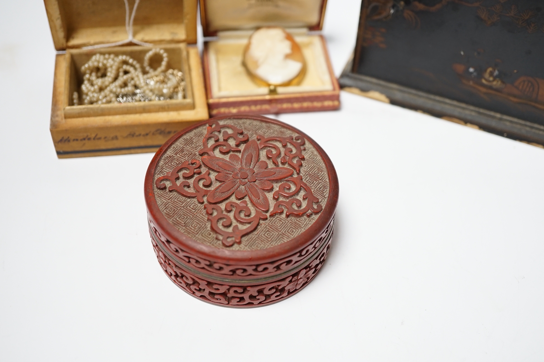 A chinoiserie lacquer letter rack, a Regency wine coaster, a seed-pearl necklace, a cameo brooch, etc.